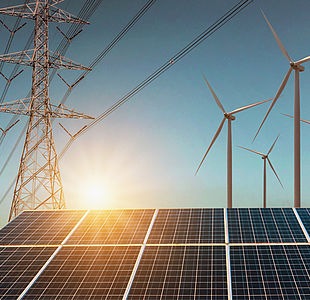 Wind turbine with solar panels and electricity high voltage istock254992853