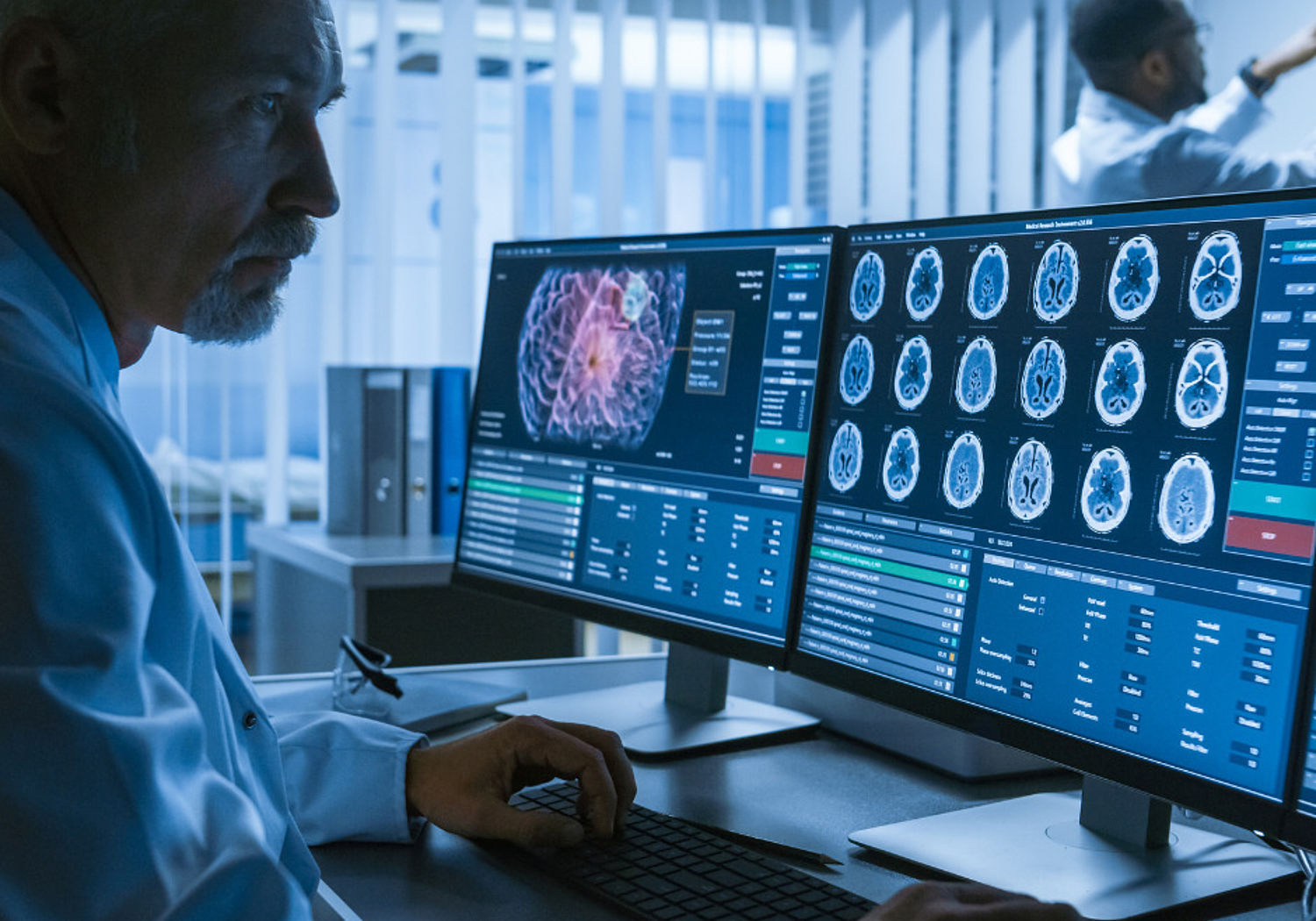 Image of a doctor examiing CT results on a computer screen