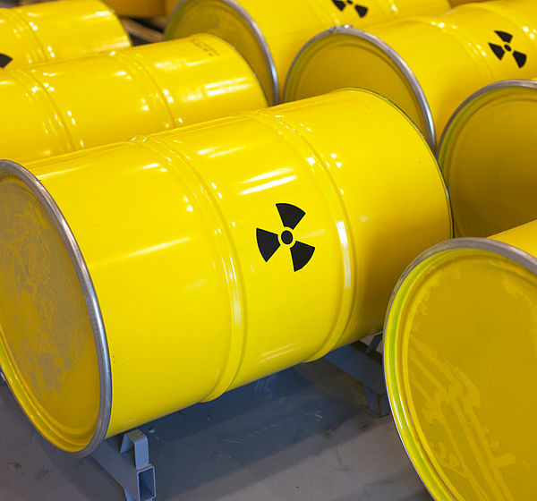 Image showing rows of yellow radioactive waste barrels