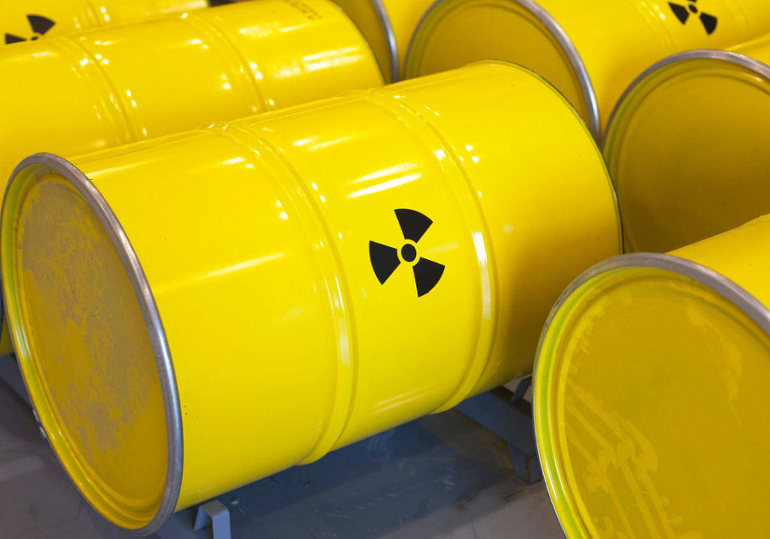 Image showing rows of yellow radioactive waste barrels