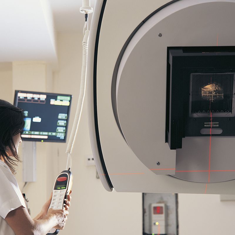 Building x-ray dosimetry capability Image showing a Clinician operating a linear accelerator