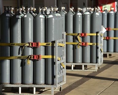 Image showing Groups of large Nitrogen gas bottles on stands 