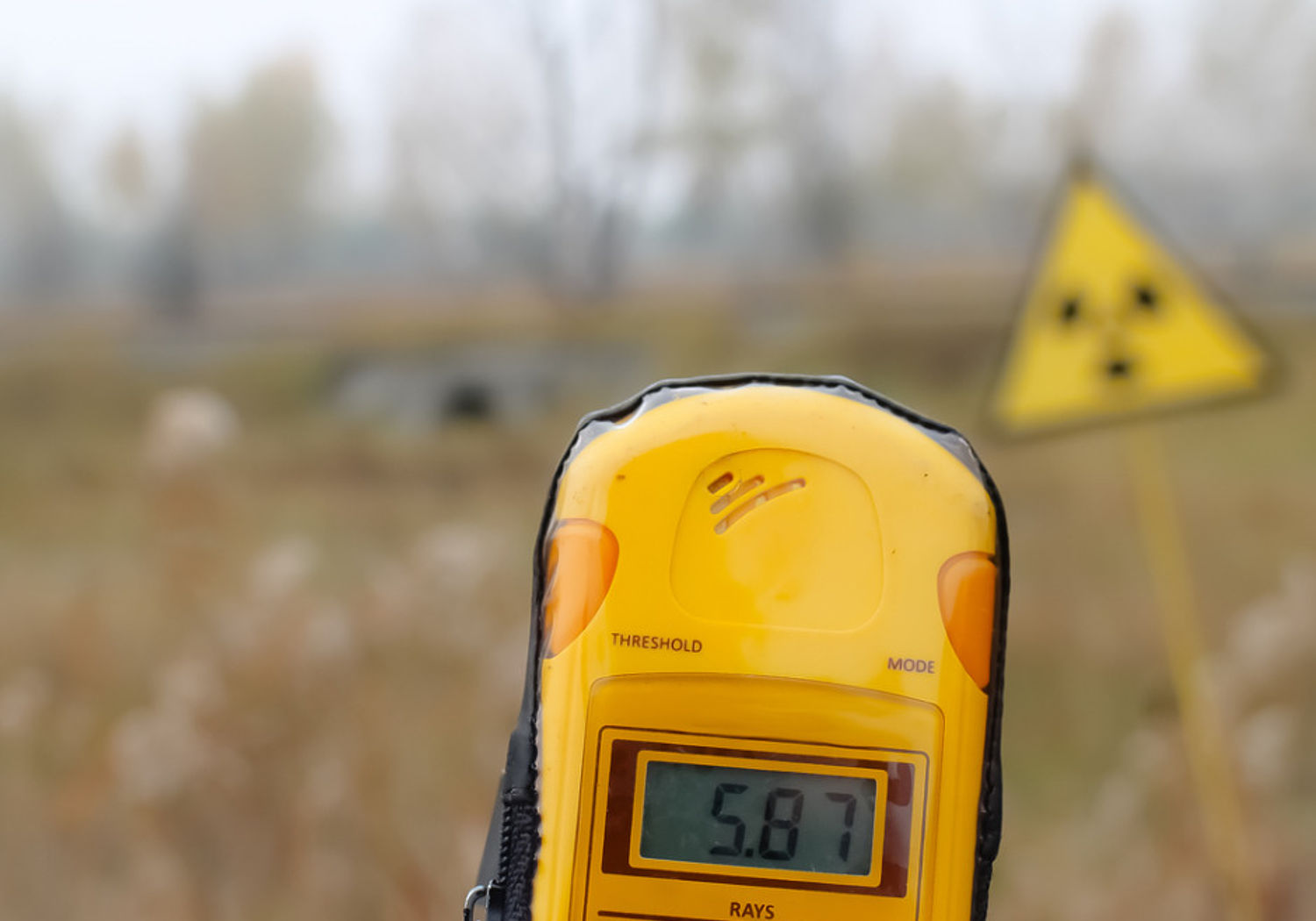 Image showing a Dosimeter and radiation warning sign