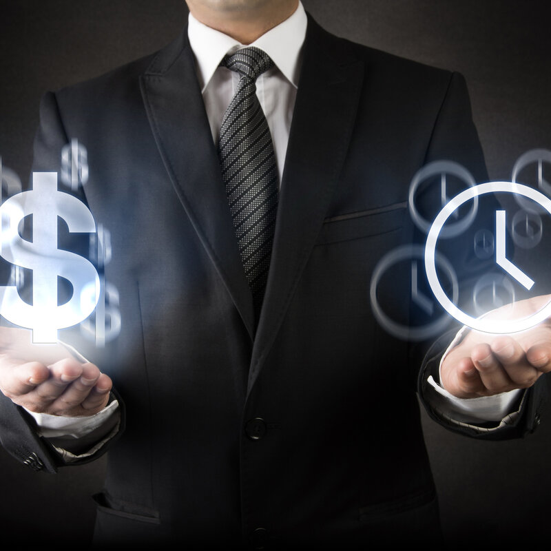 Developing the next generation of atomic clocks Image showing a businessman showing 'Time is Money' concept