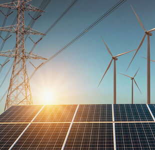 Wind turbine with solar panels and electricity high voltage istock254992853